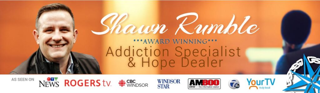 Shawn Rumble, Award Winning Addiction Specialist and Hope Dealer, speaking at a microphone
