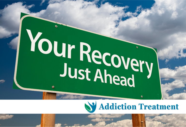 A prominent billboard displaying the message 'Your Recovery Just Ahead